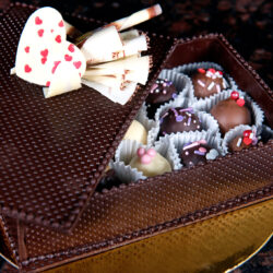 Assorted truffles in dark chocolate box